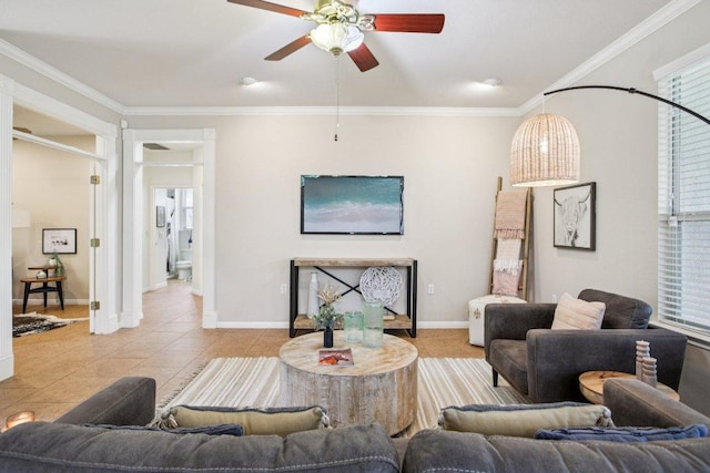 136 Trail Of The Flowers, Georgetown, TX 78633 - tiled living room with a ceiling fan and crown molding