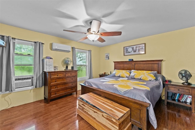 1200 County Road 149, Georgetown, TX 78626 - bedroom with an AC wall unit, multiple windows, and wood finished floors