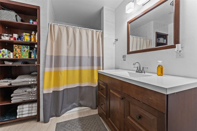 1200 County Road 149, Georgetown, TX 78626 - full bath featuring vanity, wood finished floors, and curtained shower