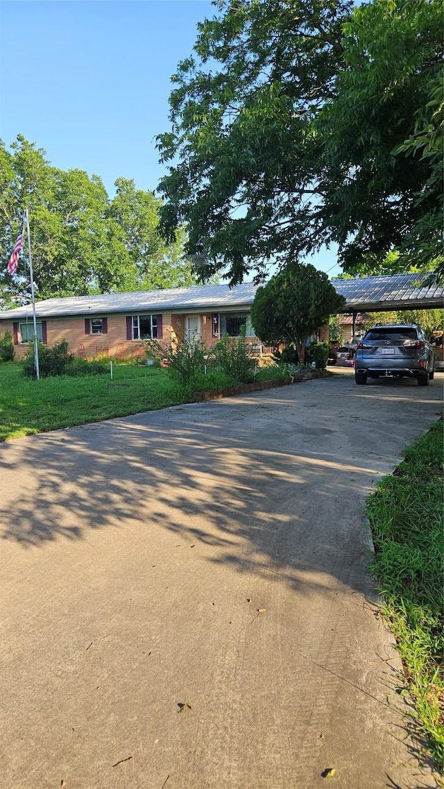 3222 County Road 2403rd Rd, Winnsboro, TX 75494 - ranch-style house featuring asphalt driveway and a detached carport