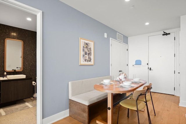 48 E Ave Unit 2707, Austin, TX 78701 - dining area featuring recessed lighting and light wood-style floors