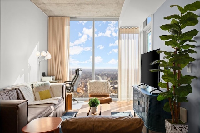 48 E Ave Unit 2707, Austin, TX 78701 - living room with floor to ceiling windows and wood finished floors
