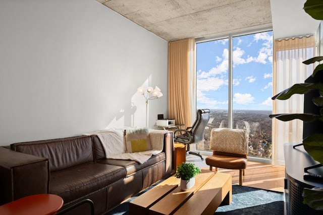 48 E Ave Unit 2707, Austin, TX 78701 - living area with wood finished floors and a wall of windows