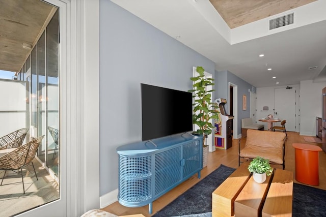 48 E Ave Unit 2707, Austin, TX 78701 - living area featuring wood finished floors and recessed lighting