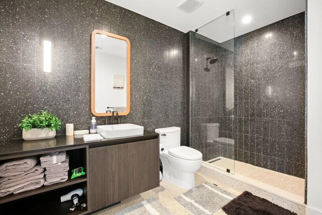 48 E Ave Unit 2707, Austin, TX 78701 - bathroom featuring a walk in shower and vanity