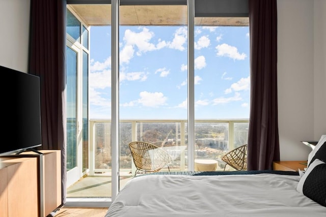48 E Ave Unit 2707, Austin, TX 78701 - bedroom with wood finished floors