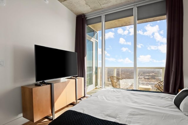 48 E Ave Unit 2707, Austin, TX 78701 - bedroom with multiple windows and access to exterior