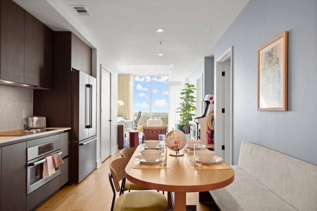 48 E Ave Unit 2707, Austin, TX 78701 - dining area featuring light wood finished floors