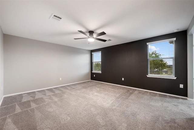 101 Crimson Ln, Kyle, TX 78640 - spare room featuring carpet floors and ceiling fan