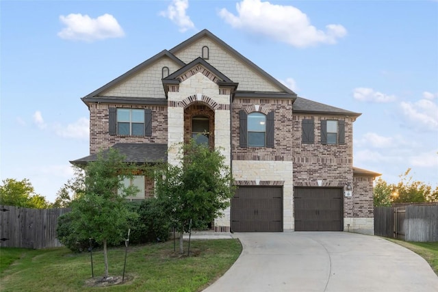 101 Crimson Ln, Kyle, TX 78640 - french provincial home with brick siding, an attached garage, and concrete driveway