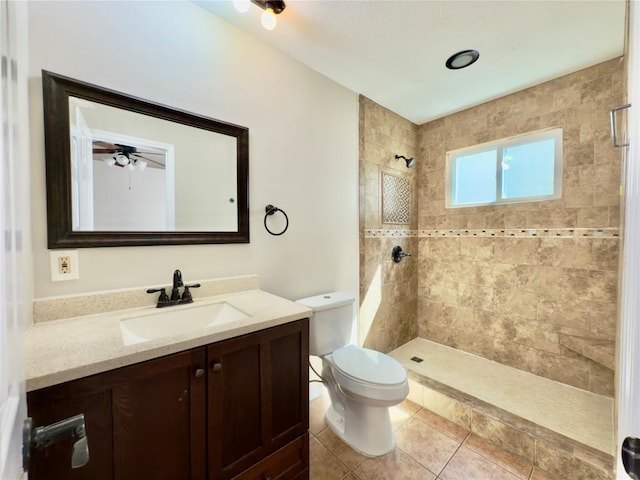 6400 Jennings Dr, Austin, TX 78727 - bathroom with tiled shower, vanity, and tile patterned flooring