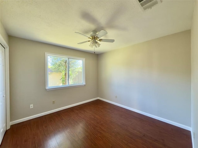 6400 Jennings Dr, Austin, TX 78727 - spare room featuring dark wood-type flooring and ceiling fan