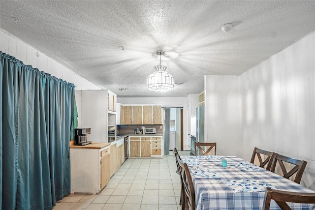 906 Lynn Ln, Copperas Cove, TX 76522 - dining space featuring a textured ceiling, a chandelier, and light tile patterned flooring