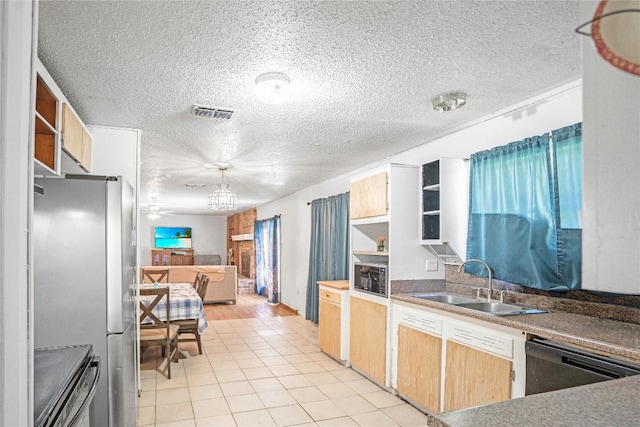 906 Lynn Ln, Copperas Cove, TX 76522 - kitchen with appliances with stainless steel finishes, open shelves, light tile patterned floors, a textured ceiling, and open floor plan