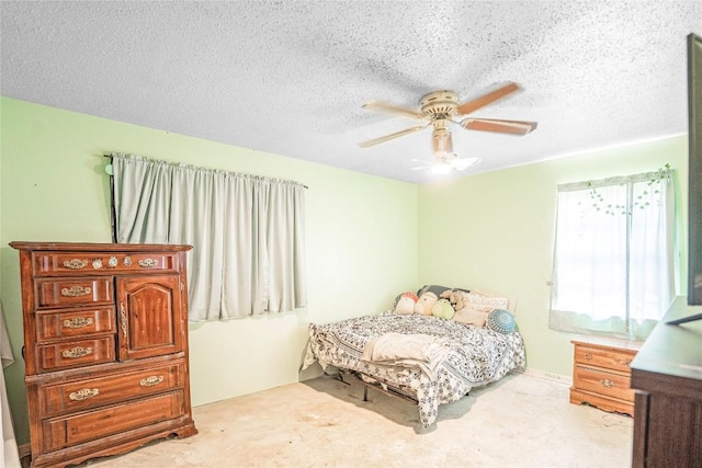 906 Lynn Ln, Copperas Cove, TX 76522 - bedroom featuring a textured ceiling, carpet, and ceiling fan