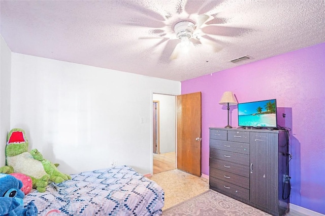 906 Lynn Ln, Copperas Cove, TX 76522 - bedroom with a textured ceiling and a ceiling fan