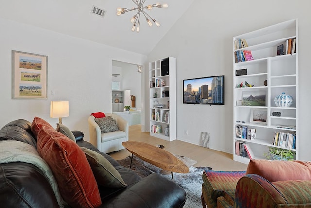 6302 Gato Path, Austin, TX 78731 - living area with a chandelier, wood finished floors, and high vaulted ceiling