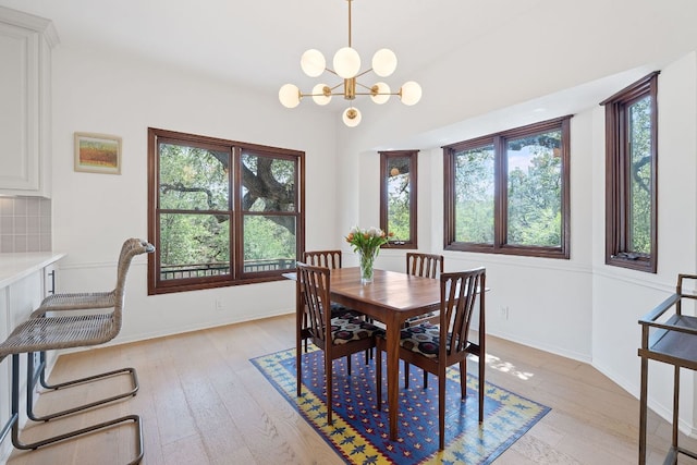 6302 Gato Path, Austin, TX 78731 - dining area featuring plenty of natural light, light wood-type flooring, and a chandelier