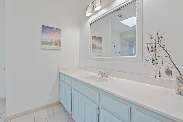 6302 Gato Path, Austin, TX 78731 - bathroom with vanity, tile patterned floors, and a shower