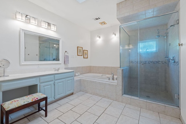 6302 Gato Path, Austin, TX 78731 - full bathroom with vanity, a garden tub, a stall shower, and tile patterned flooring