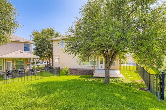 65 White Magnolia Cir, Lakeway, TX 78734 - fenced backyard featuring a patio