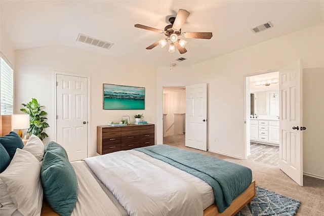 65 White Magnolia Cir, Lakeway, TX 78734 - bedroom featuring light carpet, vaulted ceiling, connected bathroom, and ceiling fan