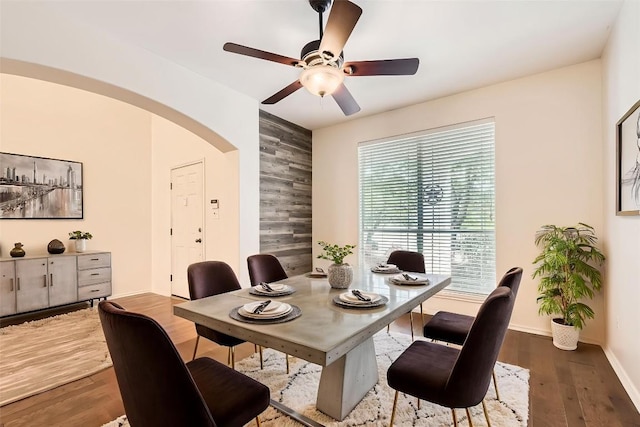65 White Magnolia Cir, Lakeway, TX 78734 - dining area with arched walkways, ceiling fan, and wood finished floors