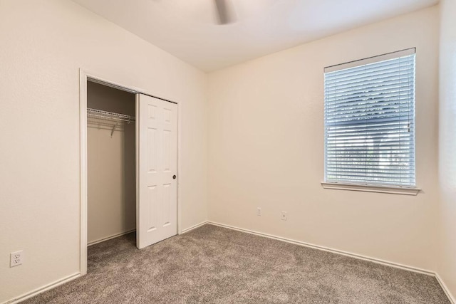 65 White Magnolia Cir, Lakeway, TX 78734 - unfurnished bedroom featuring carpet floors, a closet, and ceiling fan