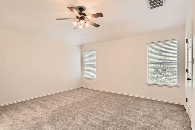 65 White Magnolia Cir, Lakeway, TX 78734 - carpeted spare room featuring healthy amount of natural light and a ceiling fan