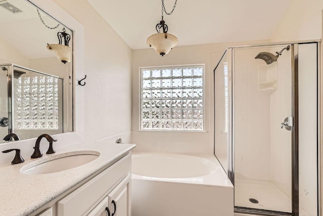 65 White Magnolia Cir, Lakeway, TX 78734 - full bath with a bath, a stall shower, and vanity