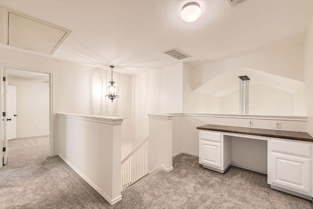 65 White Magnolia Cir, Lakeway, TX 78734 - hall with an upstairs landing, light carpet, attic access, and an office area
