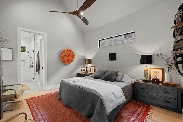 2605 Diaz St, Austin, TX 78702 - bedroom with light wood-type flooring, high vaulted ceiling, ensuite bathroom, and a ceiling fan