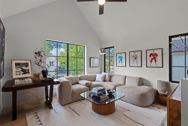 2605 Diaz St, Austin, TX 78702 - living room with high vaulted ceiling, a ceiling fan, and wood finished floors