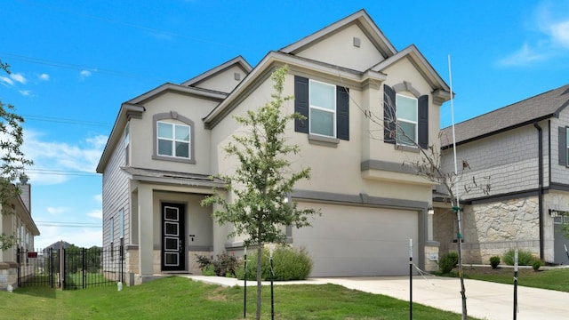 12416 Anthology St, Manor, TX 78653 - view of front facade with stucco siding, a garage, and driveway