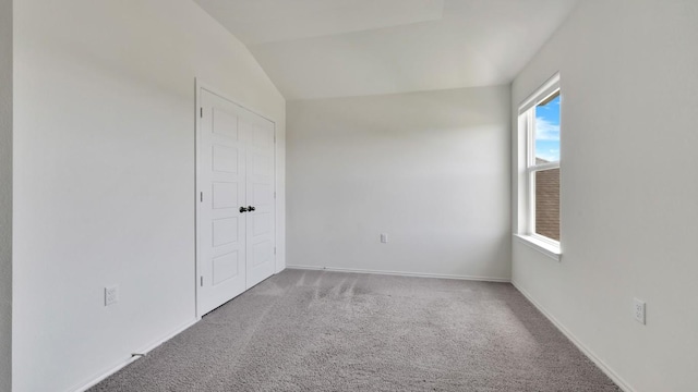 12416 Anthology St, Manor, TX 78653 - unfurnished bedroom with carpet and lofted ceiling