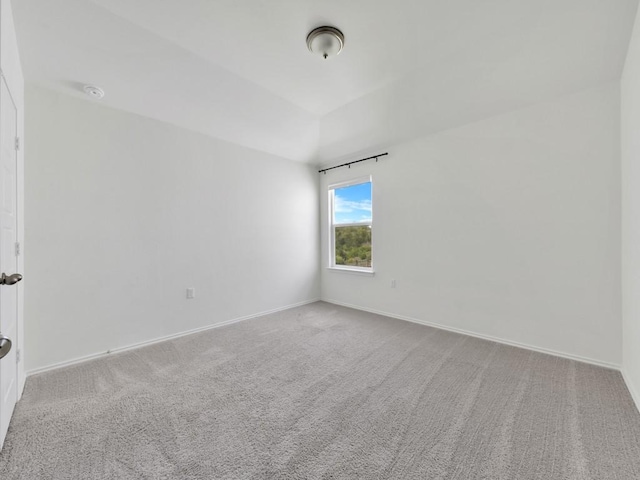 12416 Anthology St, Manor, TX 78653 - carpeted spare room with baseboards and lofted ceiling