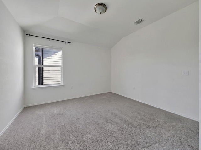 12416 Anthology St, Manor, TX 78653 - carpeted empty room with vaulted ceiling and baseboards