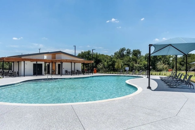 12416 Anthology St, Manor, TX 78653 - community pool with a patio area