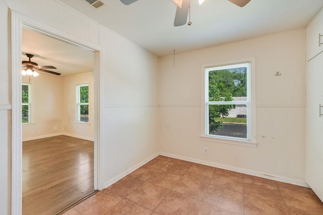 212 W 55th St, Austin, TX 78751 - spare room with a ceiling fan and baseboards