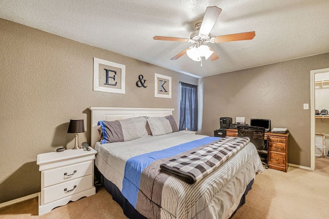 4735 Stonehaven Dr, Temple, TX 76502 - bedroom featuring a textured wall, light carpet, ceiling fan, a textured ceiling, and a desk