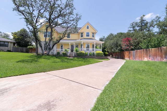 208 Norwood Cv, Georgetown, TX 78628 - victorian-style house with a porch and driveway