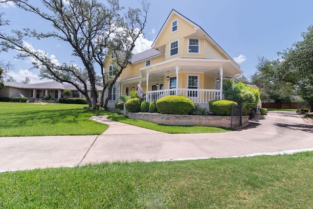 208 Norwood Cv, Georgetown, TX 78628 - victorian house with covered porch and a front yard