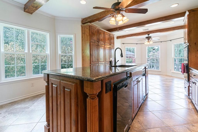 208 Norwood Cv, Georgetown, TX 78628 - kitchen featuring dishwashing machine, plenty of natural light, beamed ceiling, a center island with sink, and ceiling fan