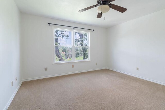 208 Norwood Cv, Georgetown, TX 78628 - empty room with light colored carpet and a ceiling fan