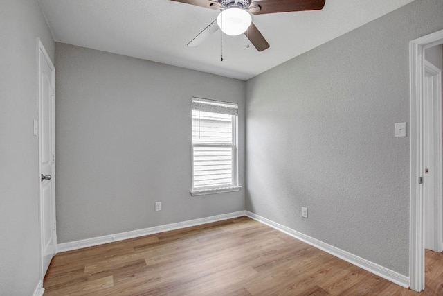 1326 Amy Dr, Kyle, TX 78640 - unfurnished room featuring ceiling fan, wood finished floors, and a textured wall