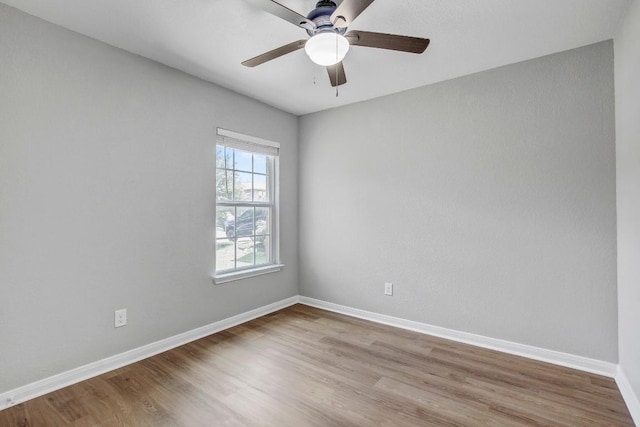 1326 Amy Dr, Kyle, TX 78640 - unfurnished room with wood finished floors and ceiling fan