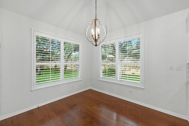 6933 Hansa Loop, Austin, TX 78739 - unfurnished room with a chandelier and dark wood-style floors