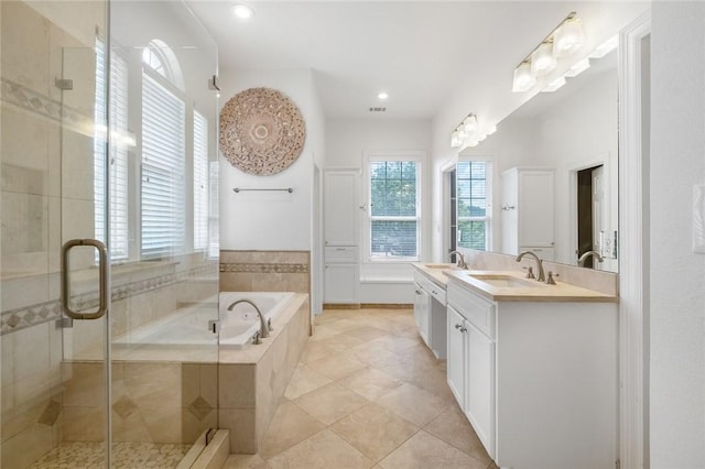 1733 Canonero Dr, Austin, TX 78746 - bathroom featuring a garden tub, double vanity, a shower stall, tile patterned floors, and recessed lighting