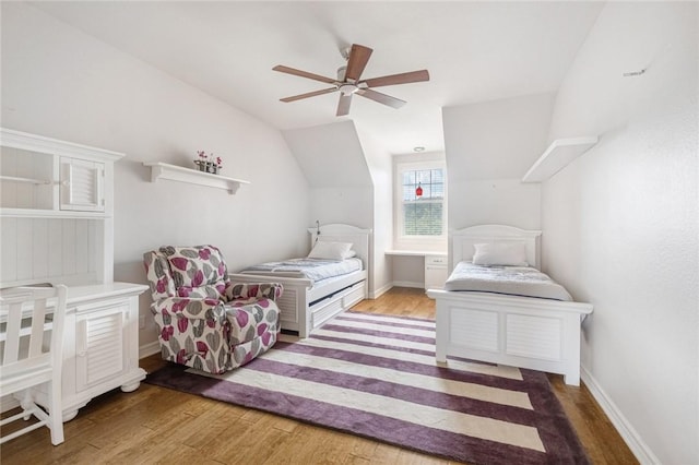 1733 Canonero Dr, Austin, TX 78746 - bedroom featuring wood finished floors, vaulted ceiling, and ceiling fan