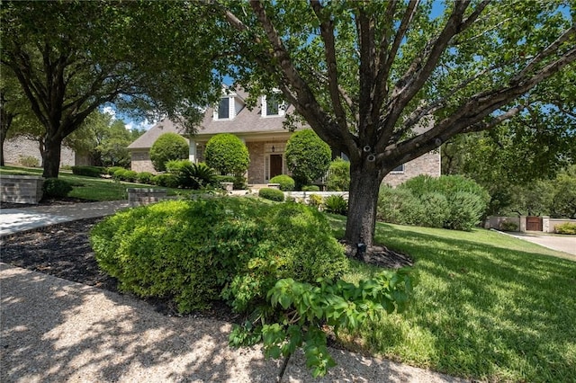 1733 Canonero Dr, Austin, TX 78746 - view of front facade featuring a front lawn